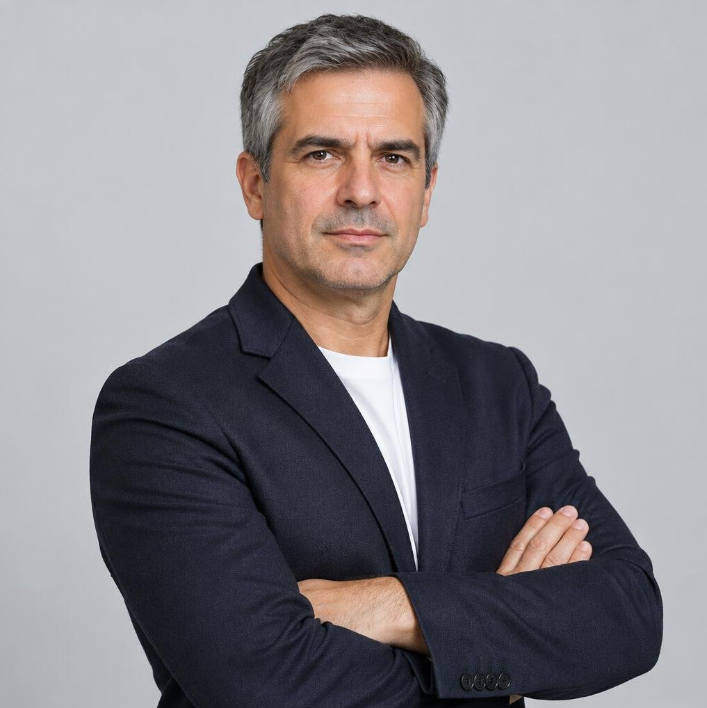 Studio portrait of a Portuguese male investigative journalist in his 40s